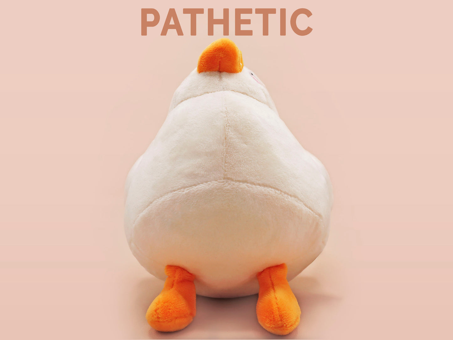 An adorable white duck bird plushie toy with cute embroidered eyes and facial expression, wearing a yellow crown hat, with a hang tag describing the duck as King Larry.