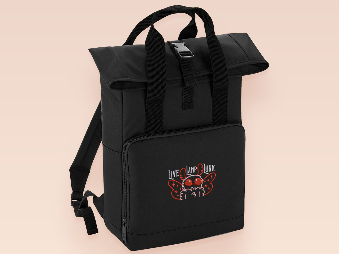 Black roll top backpack with a front pocket and an embroided mothman cryptid design with the lext live lamp lurk