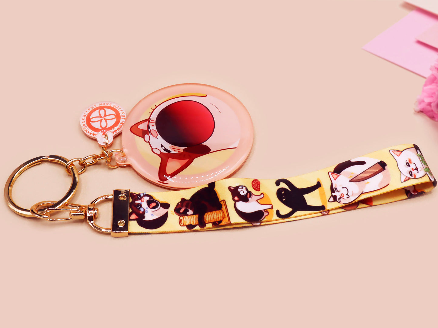 Acrylic epoxy meme cat keychain with a large acrylic charm of popcat , a smaller charm of smudge cat and a matching lanyard with multiple different internet famous meme cats.