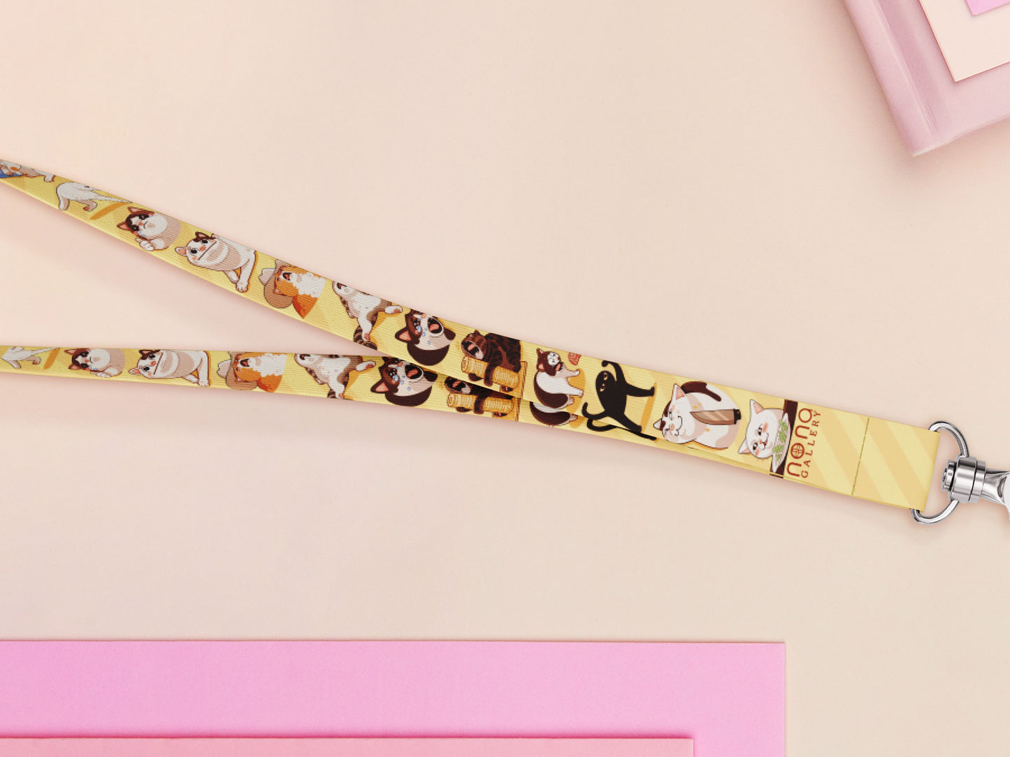 Cute full legth yellow lanyard with a double sided internet meme cat pattern and silver swivel hook clasp.