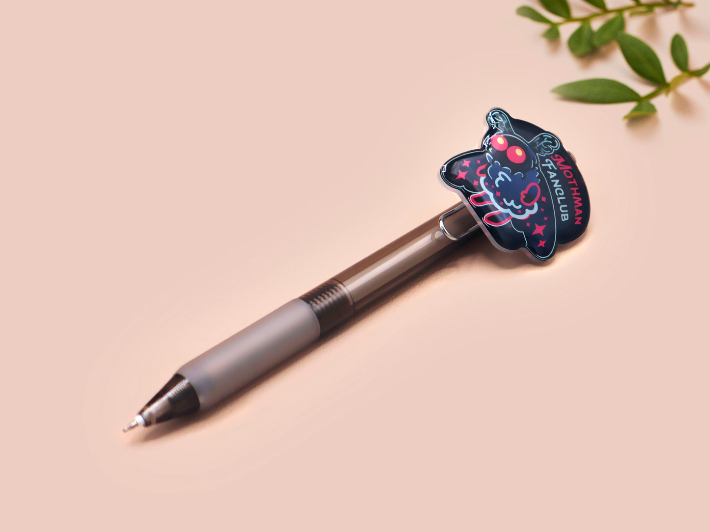 Black ballpoint pen with black ink and a cute chibi mothman cryptid fanclub design.