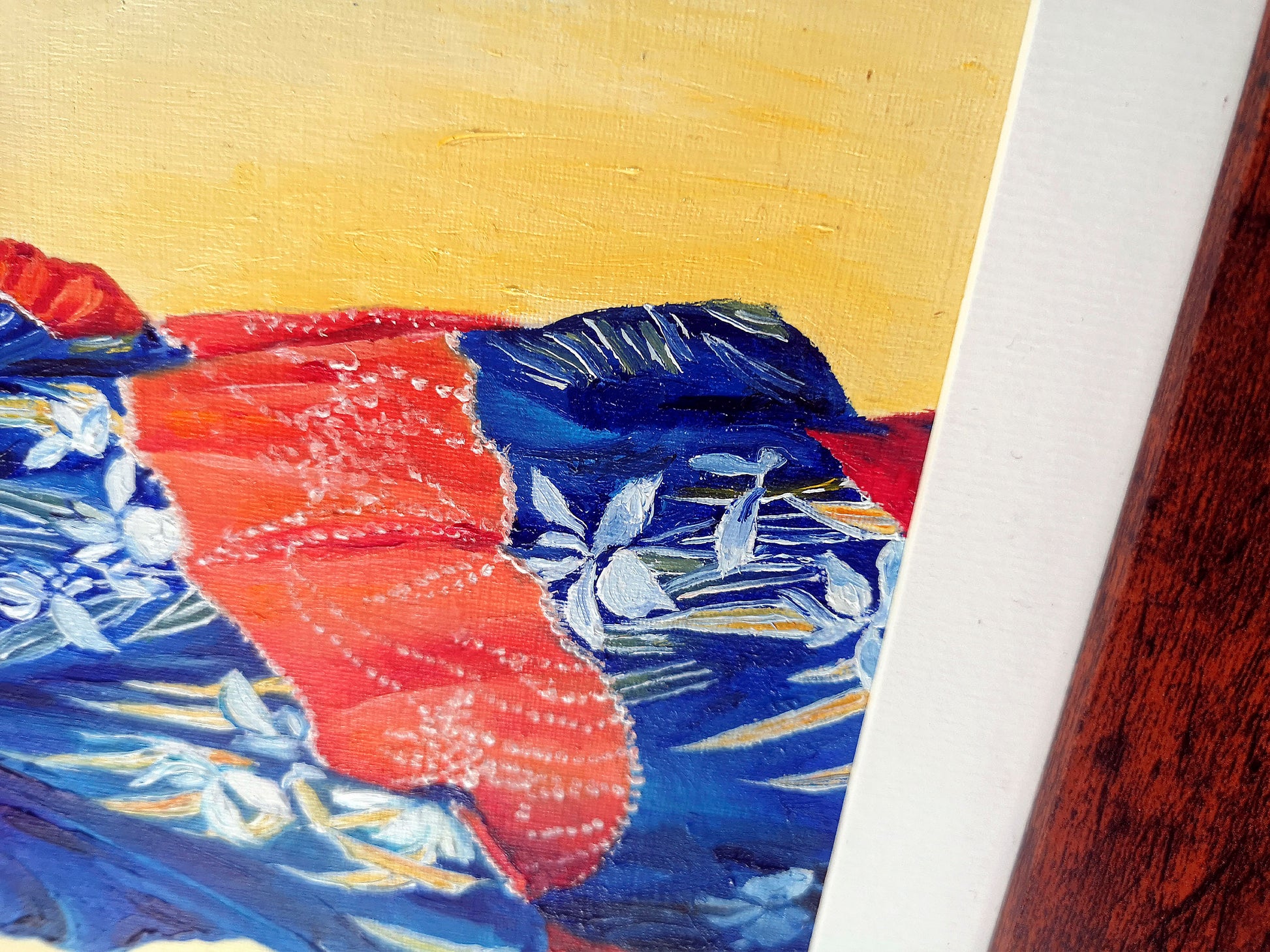 Close up of oil painting of a blue iris pattern kimono with red stripe and a yellow background.