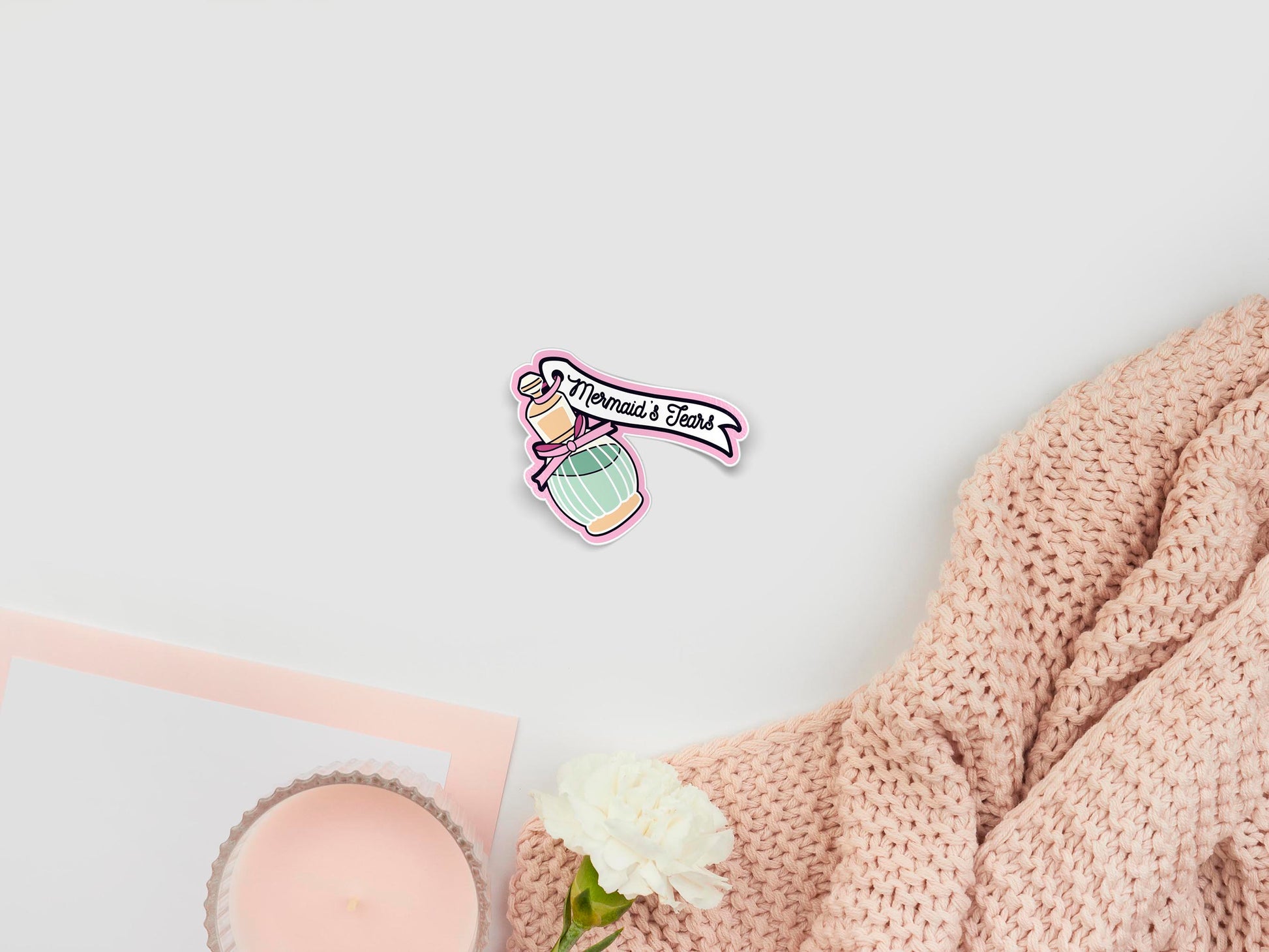 Large sticker sheet of digital illustration cartoons of a gold perfume bottle with a pink ribbon and a pale green liquid inside, labelled Mermaid's Tears