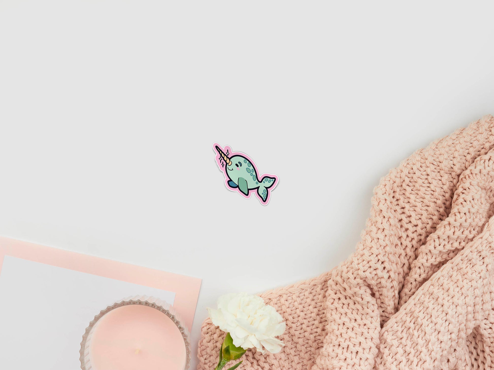 Large sticker sheet of digital illustration cartoons of a baby spotted narwhal smiling and blushing, with sparkles around their horn