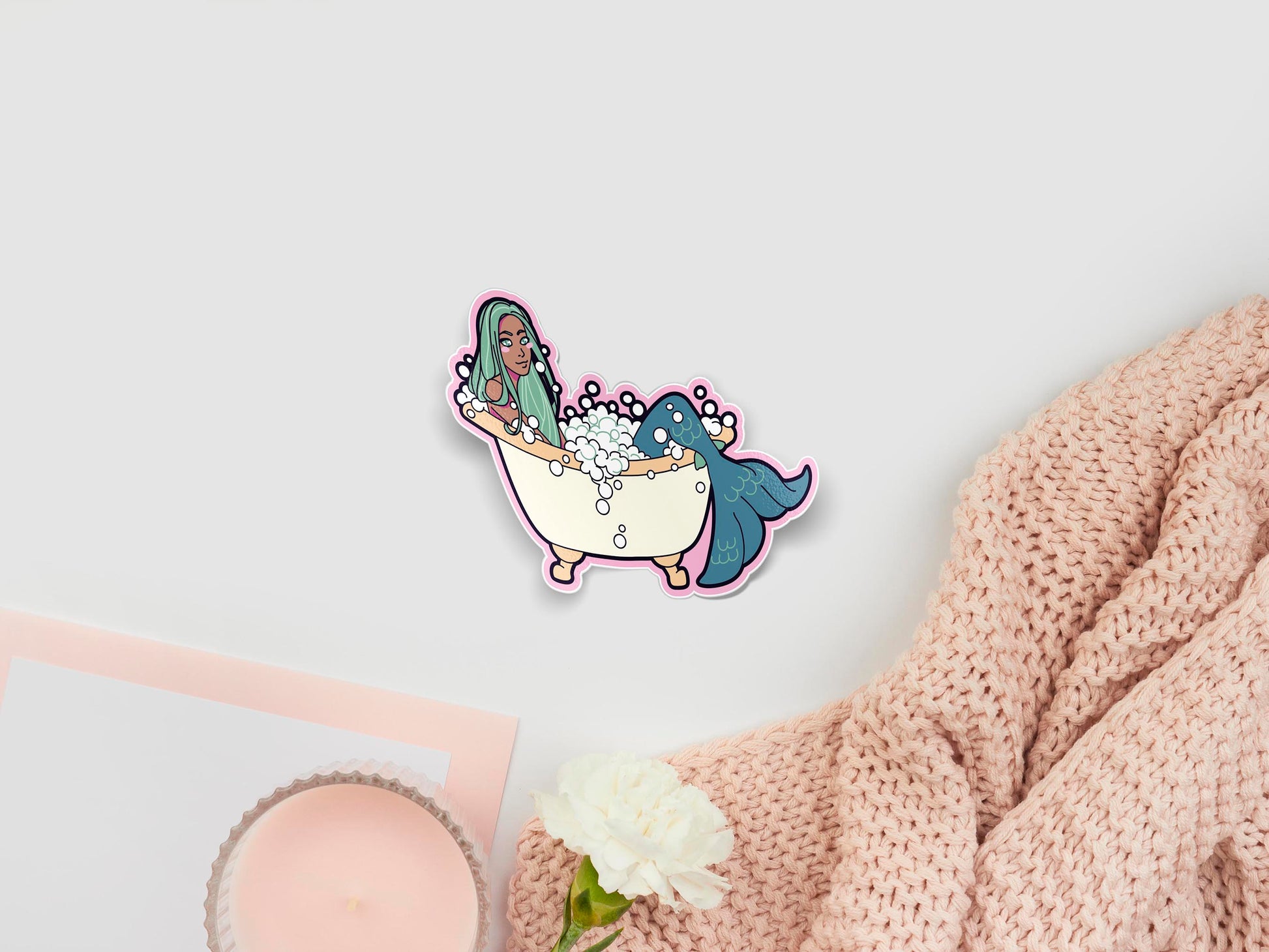 Large sticker sheet of digital illustration cartoons of a mermaid with a blue tail and green hair lying in a large bubble bath
