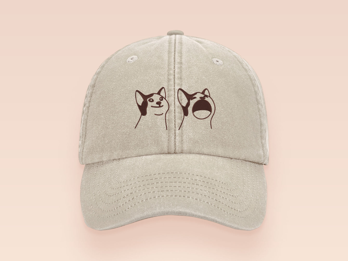 A cream baseball cap hat with an embroidered cute brown Popcat meme cat design.