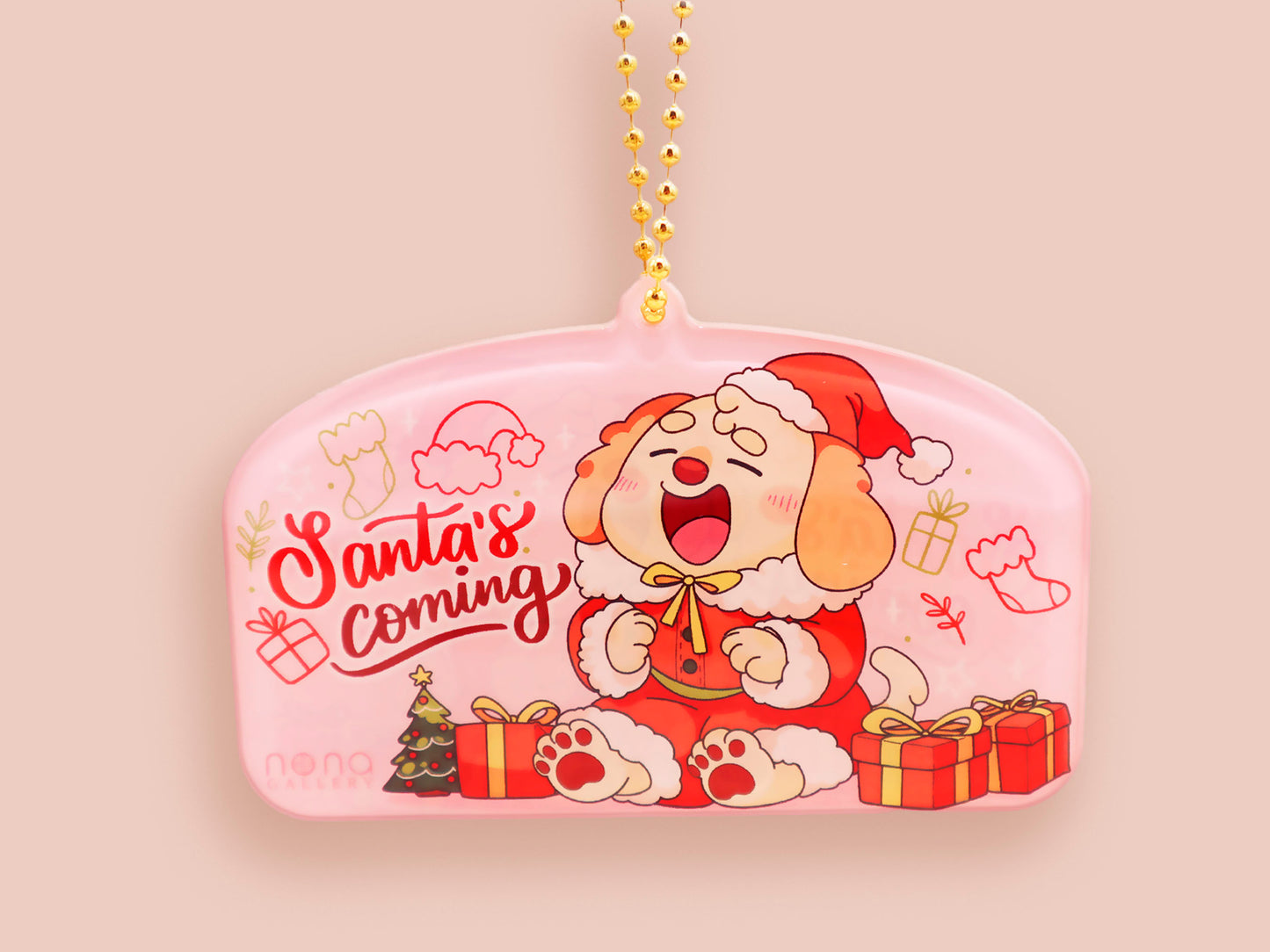 Acrylic epoxy christmas tree hanging decoration with a large acrylic charm of a cute cockapoo barley dog in a santa outfit surrounded by presents with the quoteSanta's coming