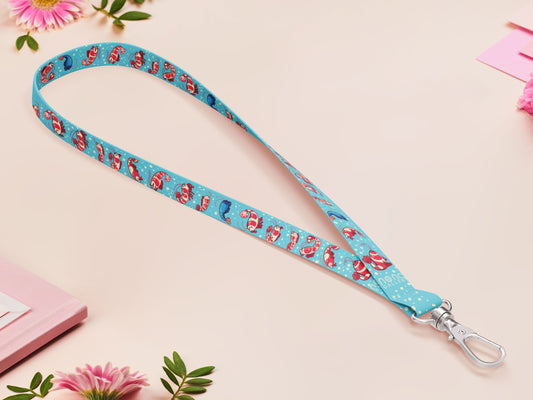 Cute full legth blue lanyard with a double sided prawn shrimp pattern and silver swivel hook clasp.