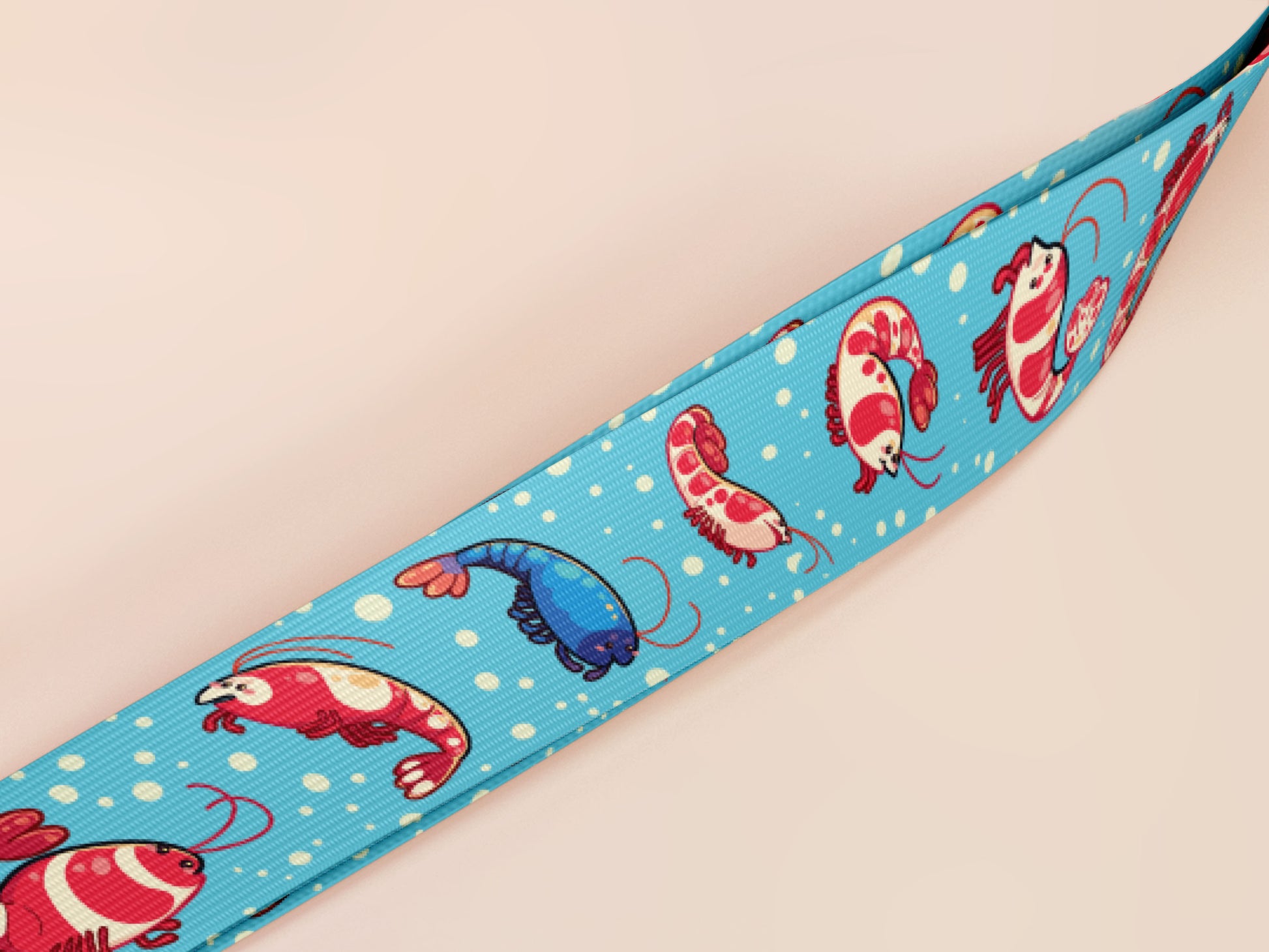 Cute full legth blue lanyard with a double sided prawn shrimp pattern and silver swivel hook clasp.
