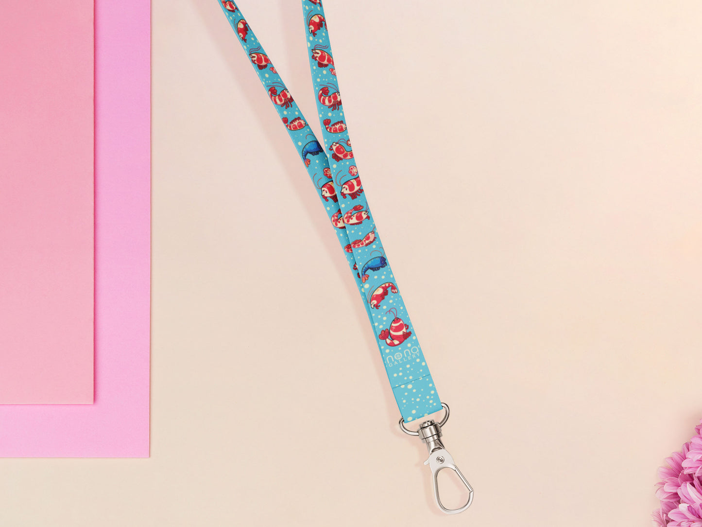 Cute full legth blue lanyard with a double sided prawn shrimp pattern and silver swivel hook clasp.