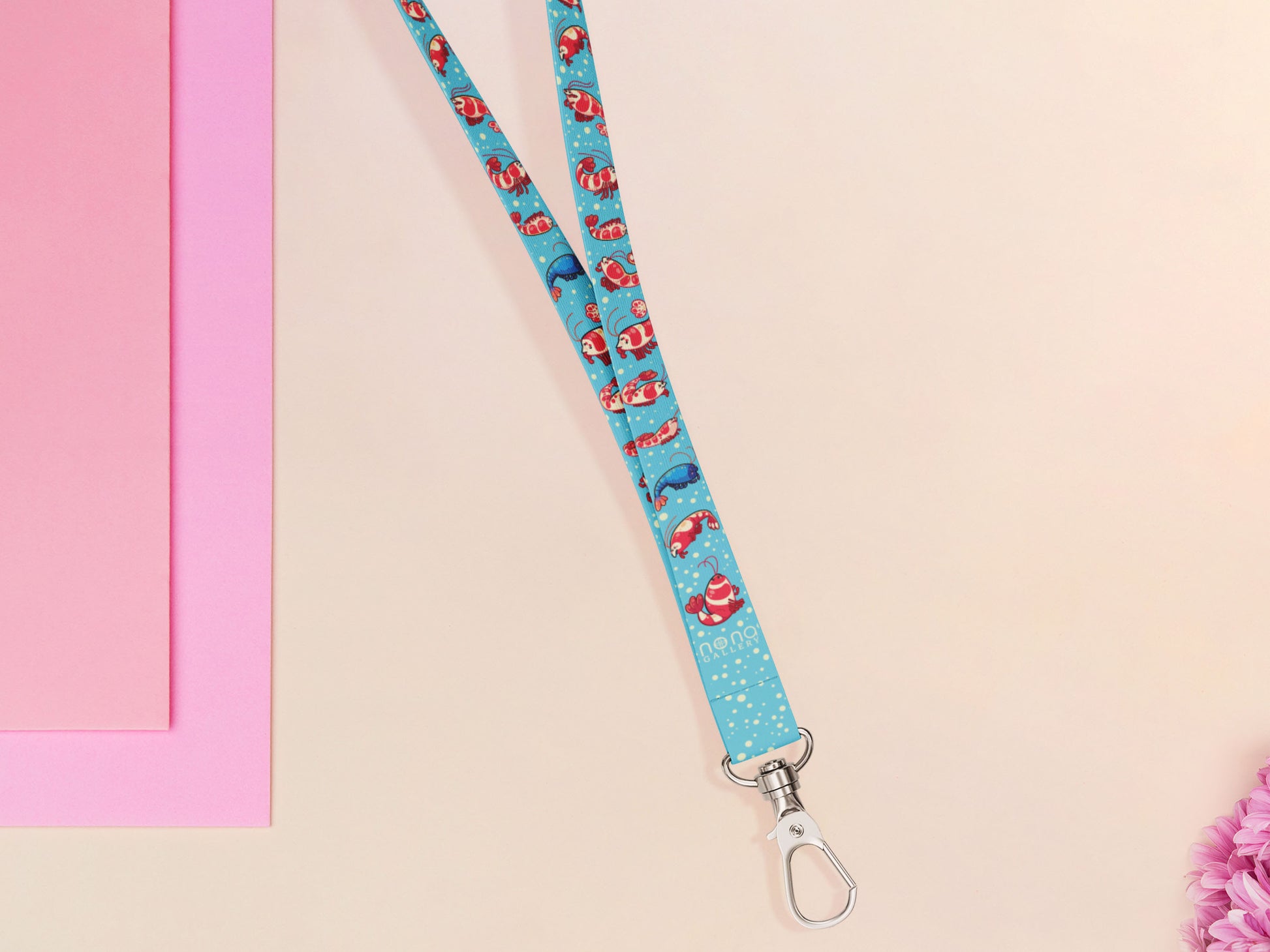Cute full legth blue lanyard with a double sided prawn shrimp pattern and silver swivel hook clasp.