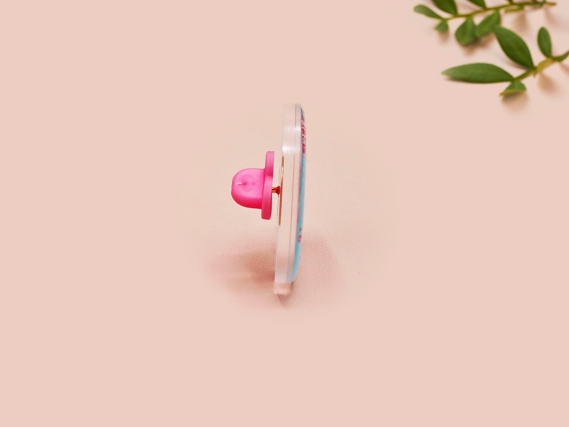 A clear acrylic pin badge with a pink heart-shaped pin back clasp. The design of the pin badge is of a cute chibi shrimp in a chefs outfit cooking with the quote So you're telling me a shrimp fried this rice?