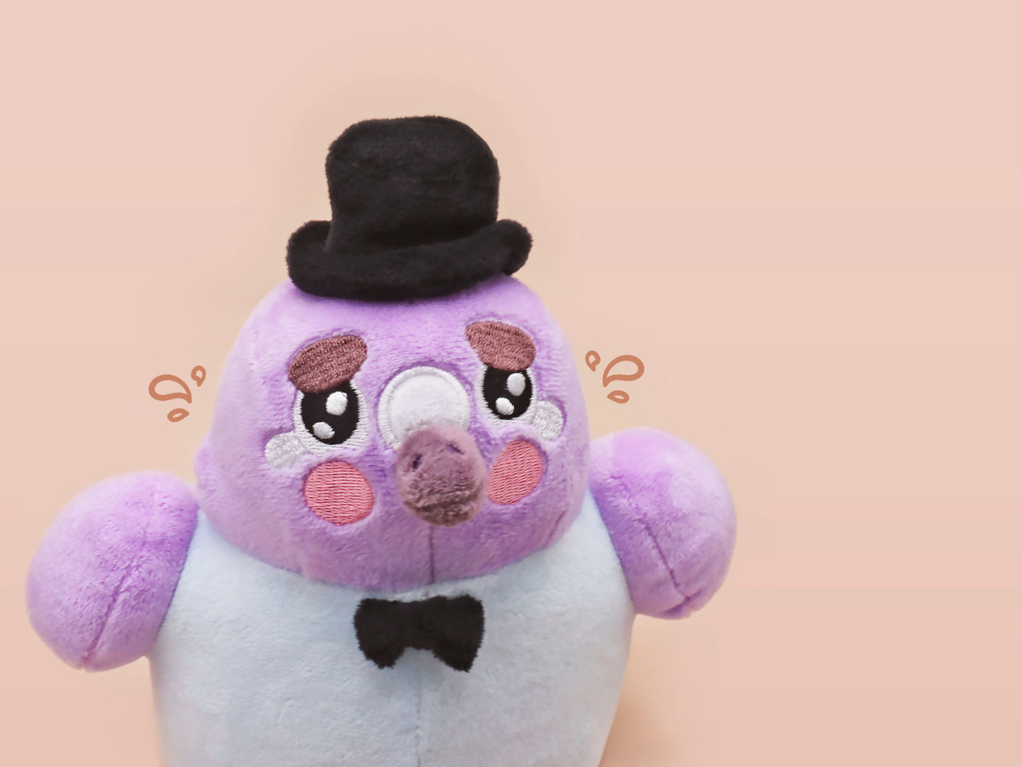 An adorable purple and blue pigeon bird plushie toy with cute embroidered eyes and facial expression, wearing a black top hat and bow tie, with a hang tag describing the pigeon as Susan.