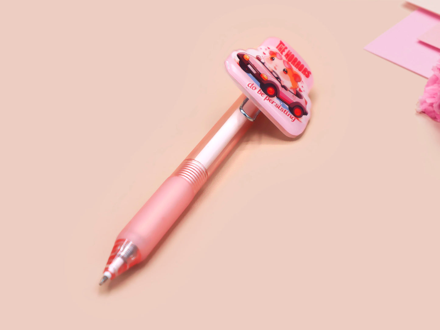 Pink ballpoint pen with black ink and a cute chibi guinea pig hamster design.