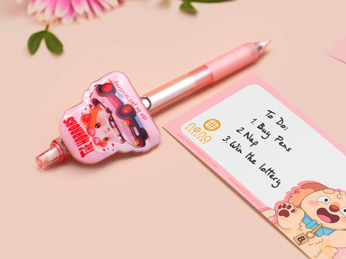 Pink ballpoint pen with black ink and a cute chibi guinea pig hamster design.