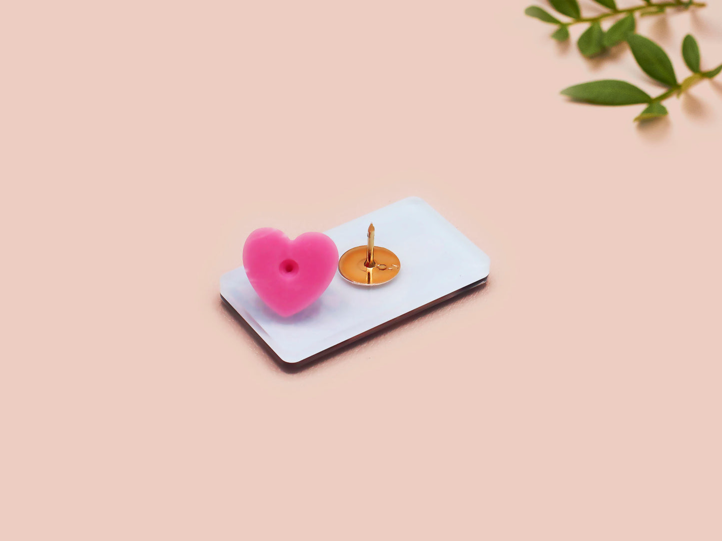 A black acrylic pin badge with a pink heart-shaped pin back clasp. The design of the pin badge is of a cute goose in a shirt and tie with the quote Time For Serious Goose