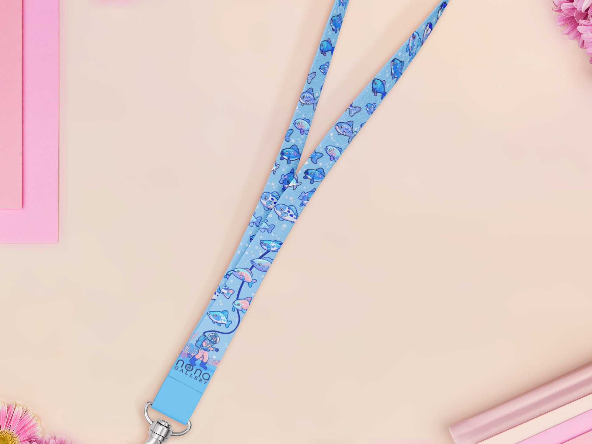 Cute full legth blue lanyard with a double sided underwater fish pattern and silver swivel hook clasp.