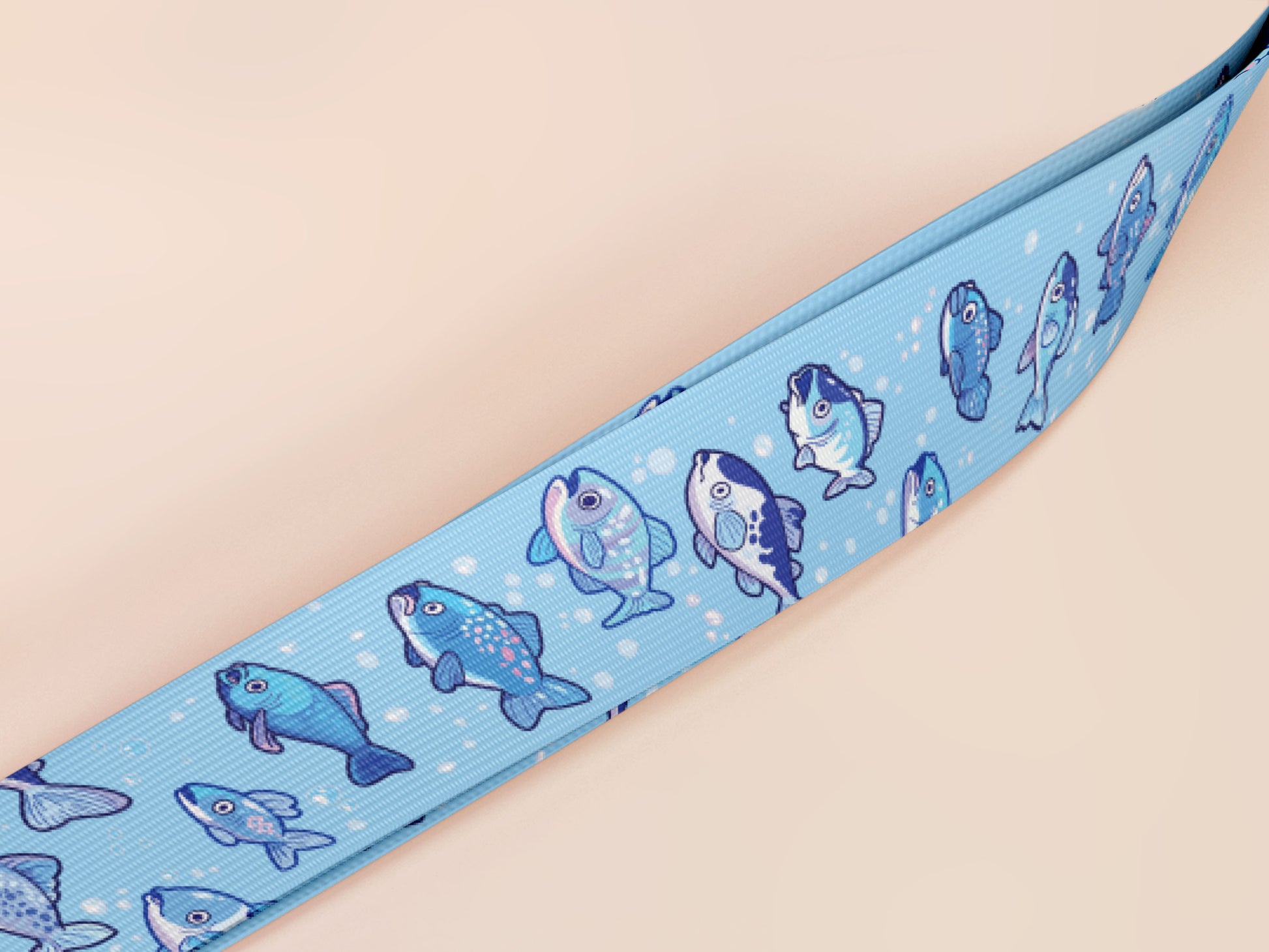 Cute full legth blue lanyard with a double sided underwater fish pattern and silver swivel hook clasp.