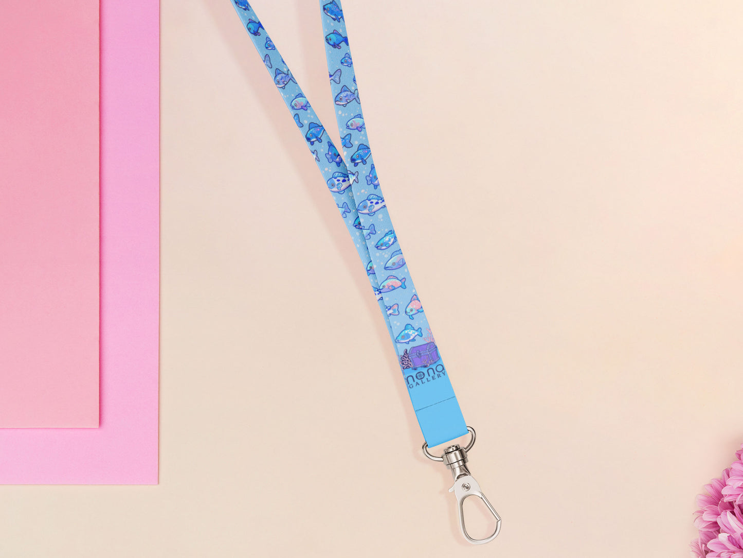 Cute full legth blue lanyard with a double sided underwater fish pattern and silver swivel hook clasp.