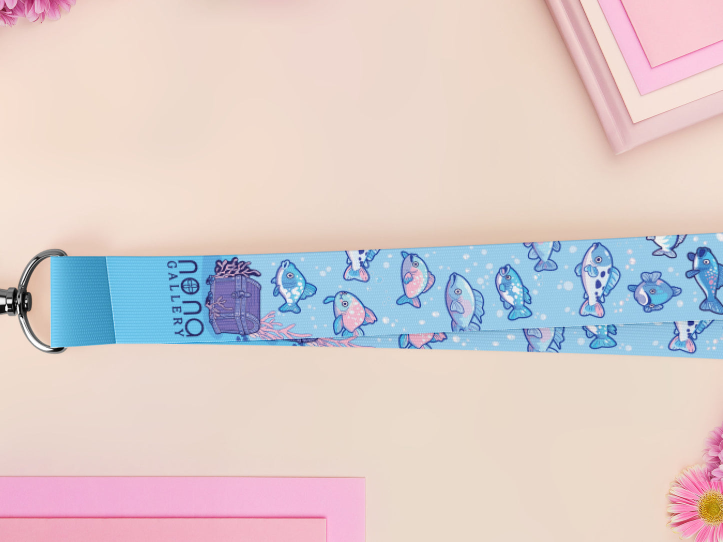 Cute full legth blue lanyard with a double sided underwater fish pattern and silver swivel hook clasp.