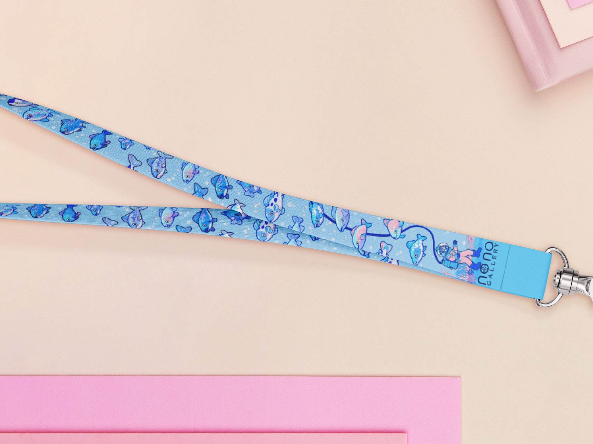 Cute full legth blue lanyard with a double sided underwater fish pattern and silver swivel hook clasp.
