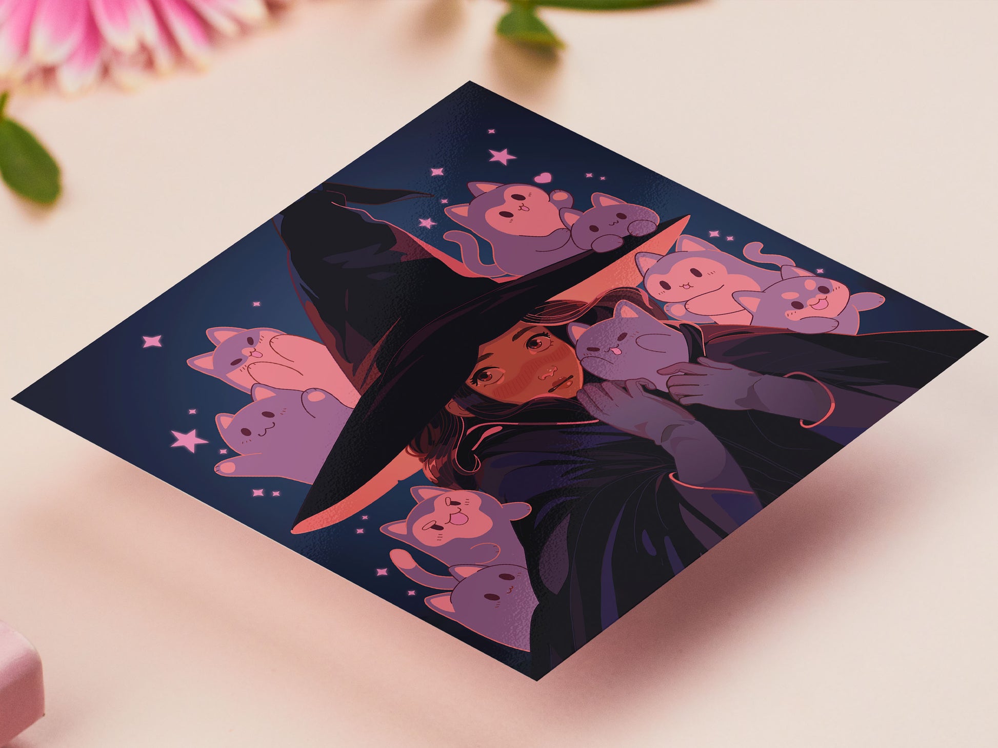 Square art print of a young witch wearing a large glowing witch's hat surrounded by nine cute chibi ghost cats.