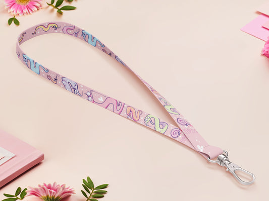 Cute full legth pink lanyard with a double sided funny worm on a string pattern and silver swivel hook clasp.