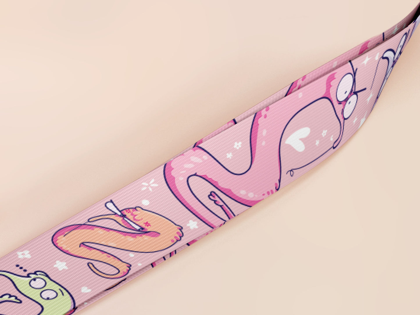 Cute full legth pink lanyard with a double sided funny worm on a string pattern and silver swivel hook clasp.