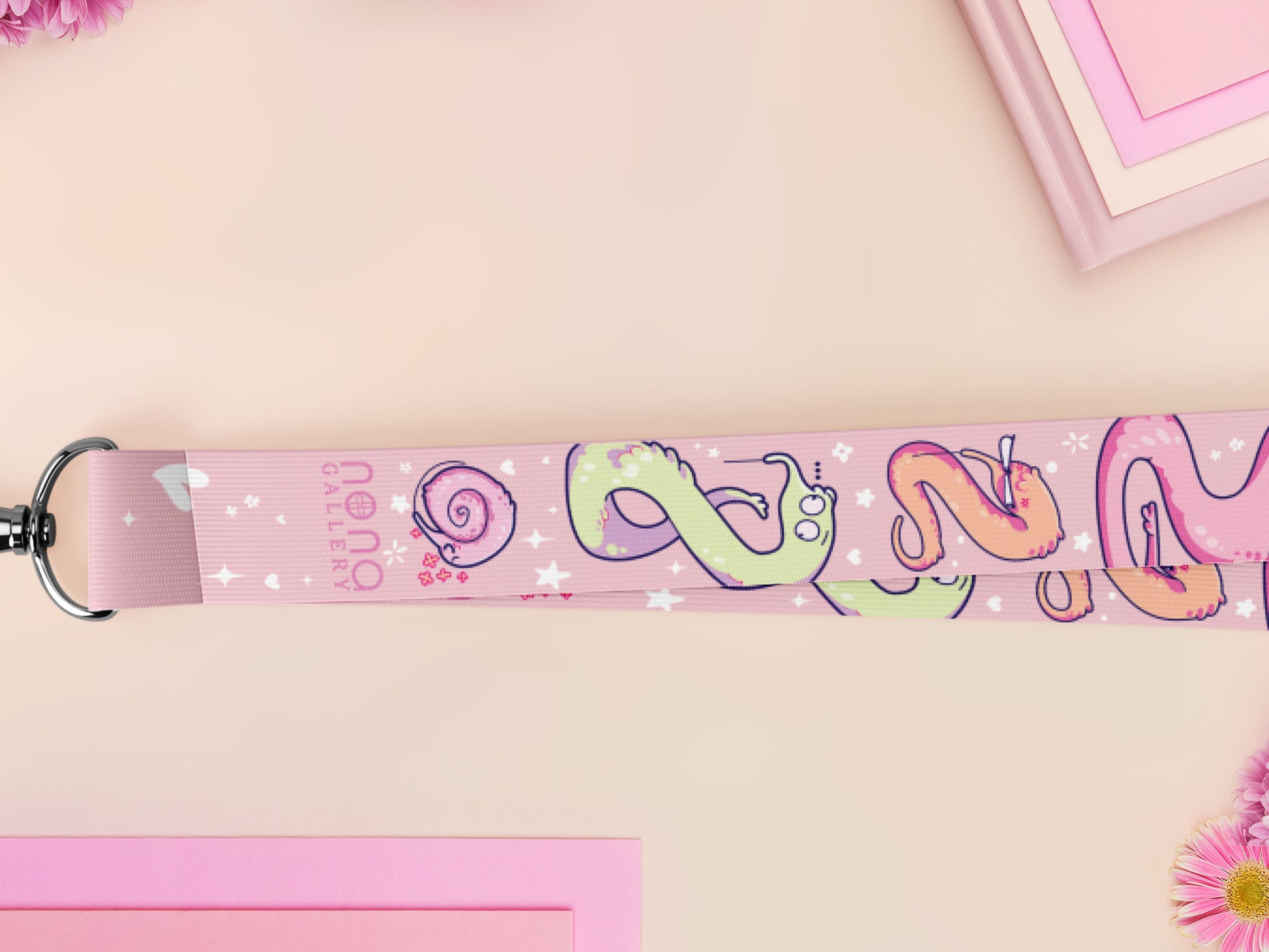 Cute full legth pink lanyard with a double sided funny worm on a string pattern and silver swivel hook clasp.