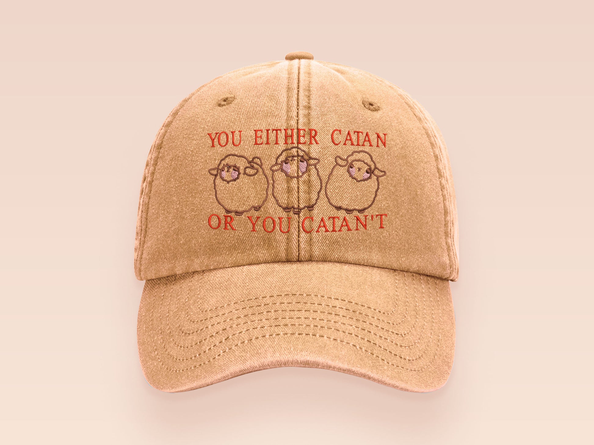 A vintage yellow baseball cap hat with an embroidered cute chibi sheep with the quote you either catan or you catan't