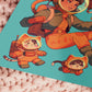 Square art print depicting a young astronaut firing a ray gun, while three adorable cats in spacesuits react.