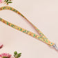 Cute full legth yellow lanyard with a double sided baby dinosuras hatcing from eggs pattern and silver swivel hook clasp.