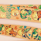 Cute full legth yellow lanyard with a double sided baby dinosuras hatcing from eggs pattern and silver swivel hook clasp.