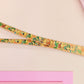 Cute full legth yellow lanyard with a double sided baby dinosuras hatcing from eggs pattern and silver swivel hook clasp.