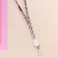 Cute full legth white lanyard with a double sided baby emperor penguin and Pesto pattern and silver swivel hook clasp.