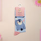 Cute knitted cotton crew socks with a cute baby emperor penguin design.