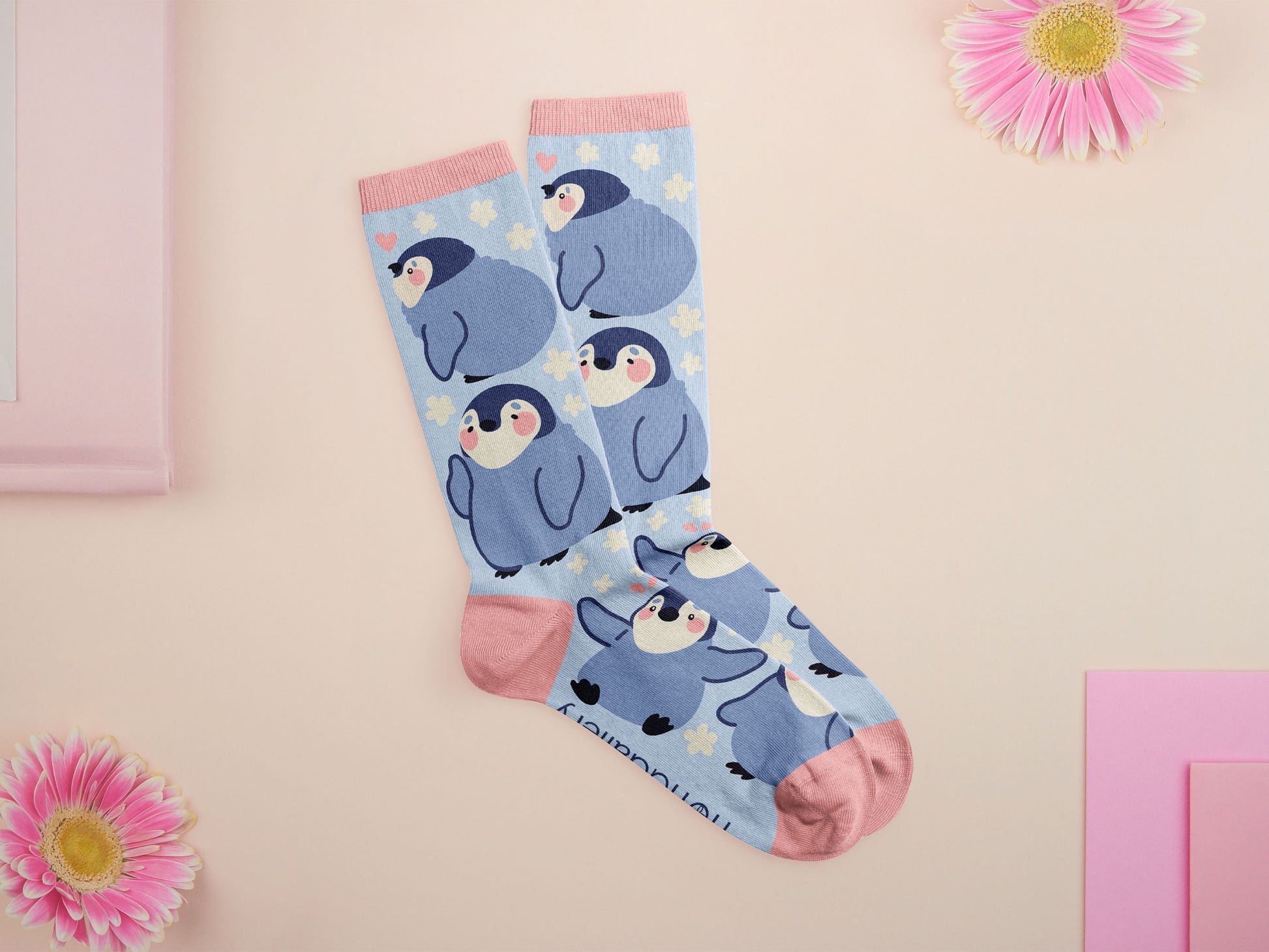 Cute knitted cotton crew socks with a cute baby emperor penguin design.