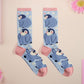 Cute knitted cotton crew socks with a cute baby emperor penguin design.