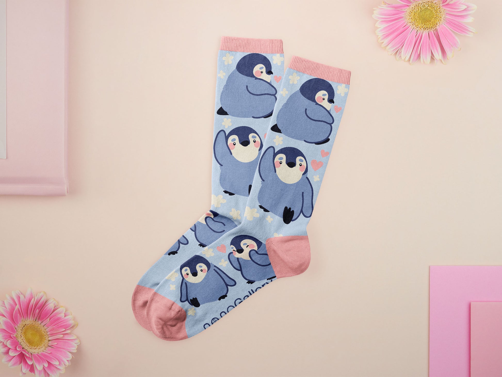 Cute knitted cotton crew socks with a cute baby emperor penguin design.