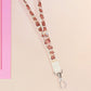 Cute full legth white lanyard with a double sided baby pygmy hippo Moo Deng pattern and silver swivel hook clasp.