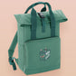 Green roll top twin handle backpack with an embroided design of cute gelatinous cube DND monster and the quote Bag of Holding