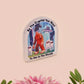 Clear acrylic pin badge with pink heart-shaped rubber pin back clasp. The design of the pin badge is a cute cartoon chibi fresno nightcrawlers, yeti bigfoot and alien UFO in a forest with the quote Be The Cryptid You Want To See In The Woods.
