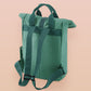 Green roll top twin handle backpack with an embroided design of cute space alien cat floating in the stars and the quote beam me up I want to leave!