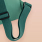 Green roll top twin handle backpack with an embroided design of cute space alien cat floating in the stars and the quote beam me up I want to leave!
