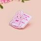 A cute transparent acrylic pin badge with a pink heart-shaped rubber clasp pin back of a chibi bunny rabbit crying with the text Bestie I am at my limit