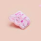 A cute transparent acrylic pin badge with a pink heart-shaped rubber clasp pin back of a chibi bunny rabbit crying with the text Bestie I am at my limit