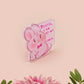 A cute transparent acrylic pin badge with a pink heart-shaped rubber clasp pin back of a chibi bunny rabbit crying with the text Bestie I am at my limit