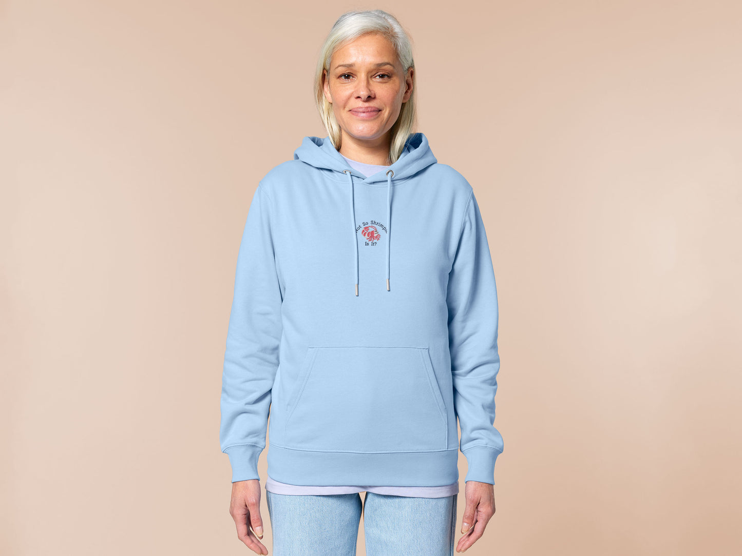 A blue long sleeve hoodie, with an embroidered chibi shrimp looking concerned and the quote Not so shrimple is it?