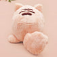 An adorable fluffy cat plushie toy with cute embroidered eyes, facial expression and applique stripes and pawprint toe beans, with a hang tag describing the cat as Brenda.