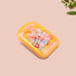 A yellow acrylic pin badge with a pink heart-shaped pin back clasp. The design of the pin badge is of a cute mouse napping in bed with a patchwork quilt with the quote can't mistakey if not awakey.